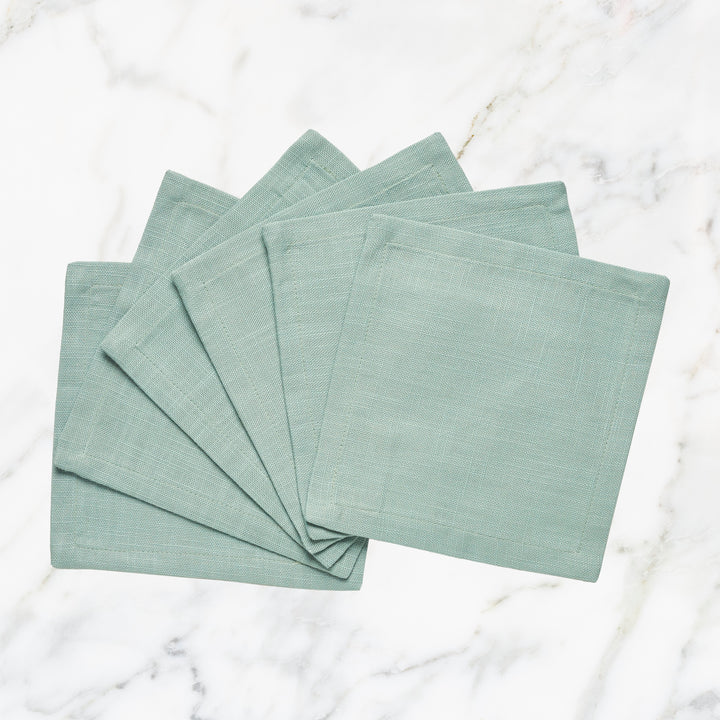 CNP-4911-66_1|Set of fan-folded mint green linen dinner napkins on marble, perfect for stylish dining, reusable, modern table decor.