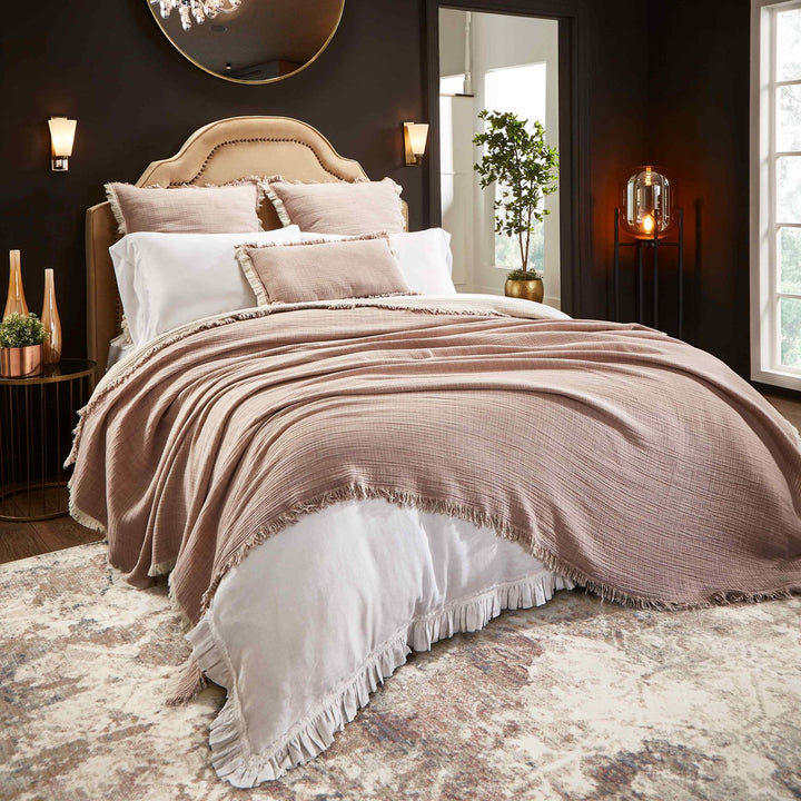 BT-110-11096_1|Charming dusty pink crinkled blanket with frayed edges draped over a bed, creating a romantic, cozy bedroom ambiance.