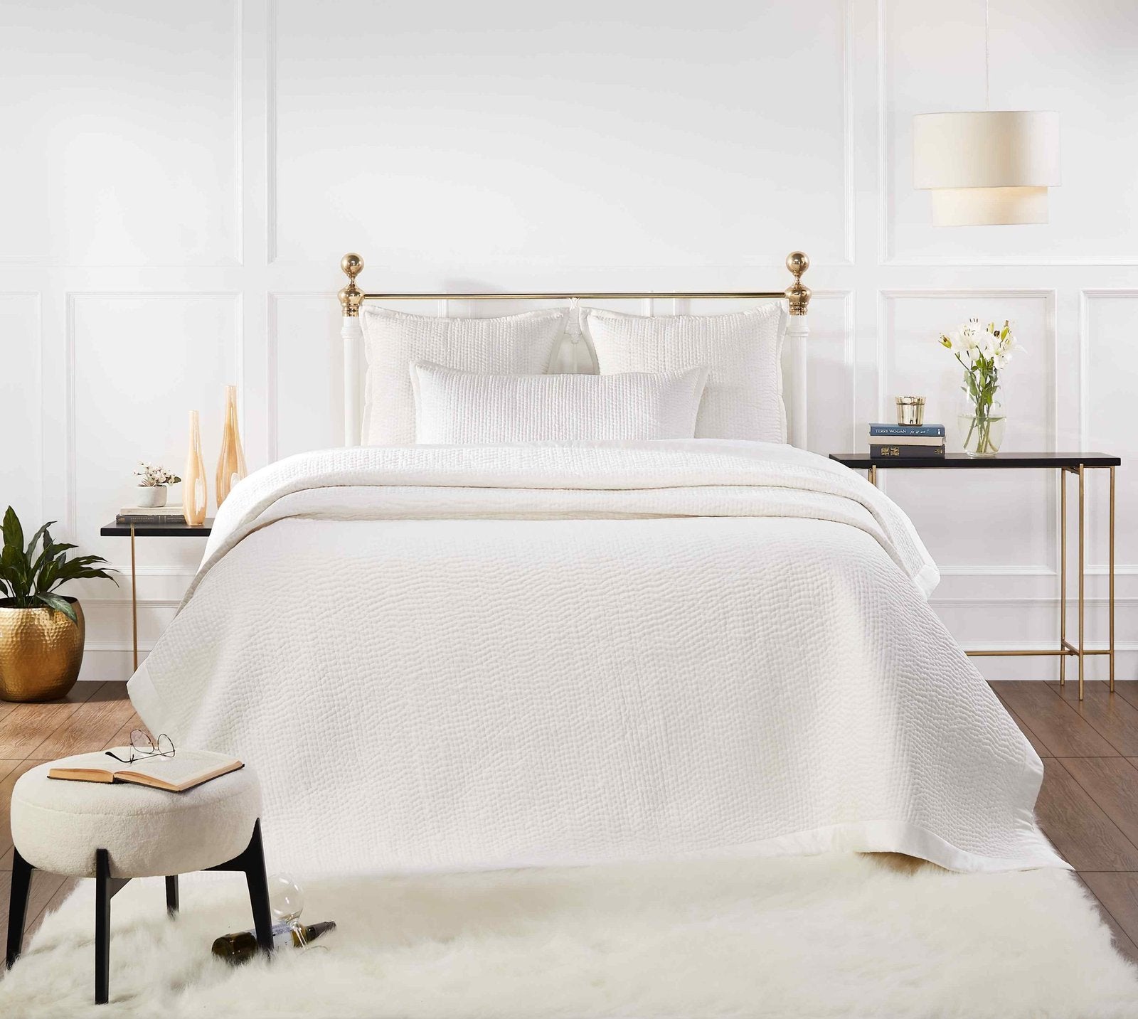 CL-165-9496_1|White quilted coverlet with subtle wave texture on a luxurious bed in a bright bedroom setting for elegant decor.