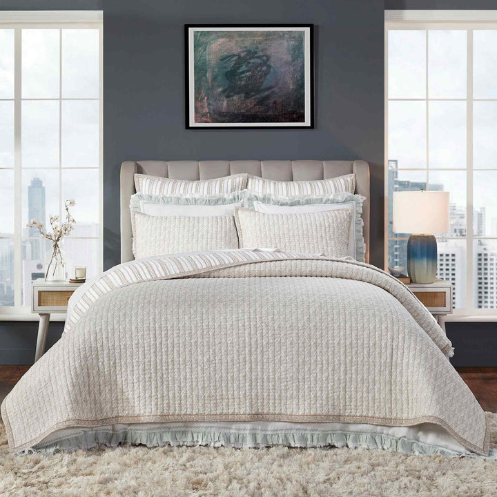 QT-347-X_1|Elegant cream textured quilt bedding set with striped accents and delicate ruffles, creating a cozy and inviting atmosphere in a modern bedroom.