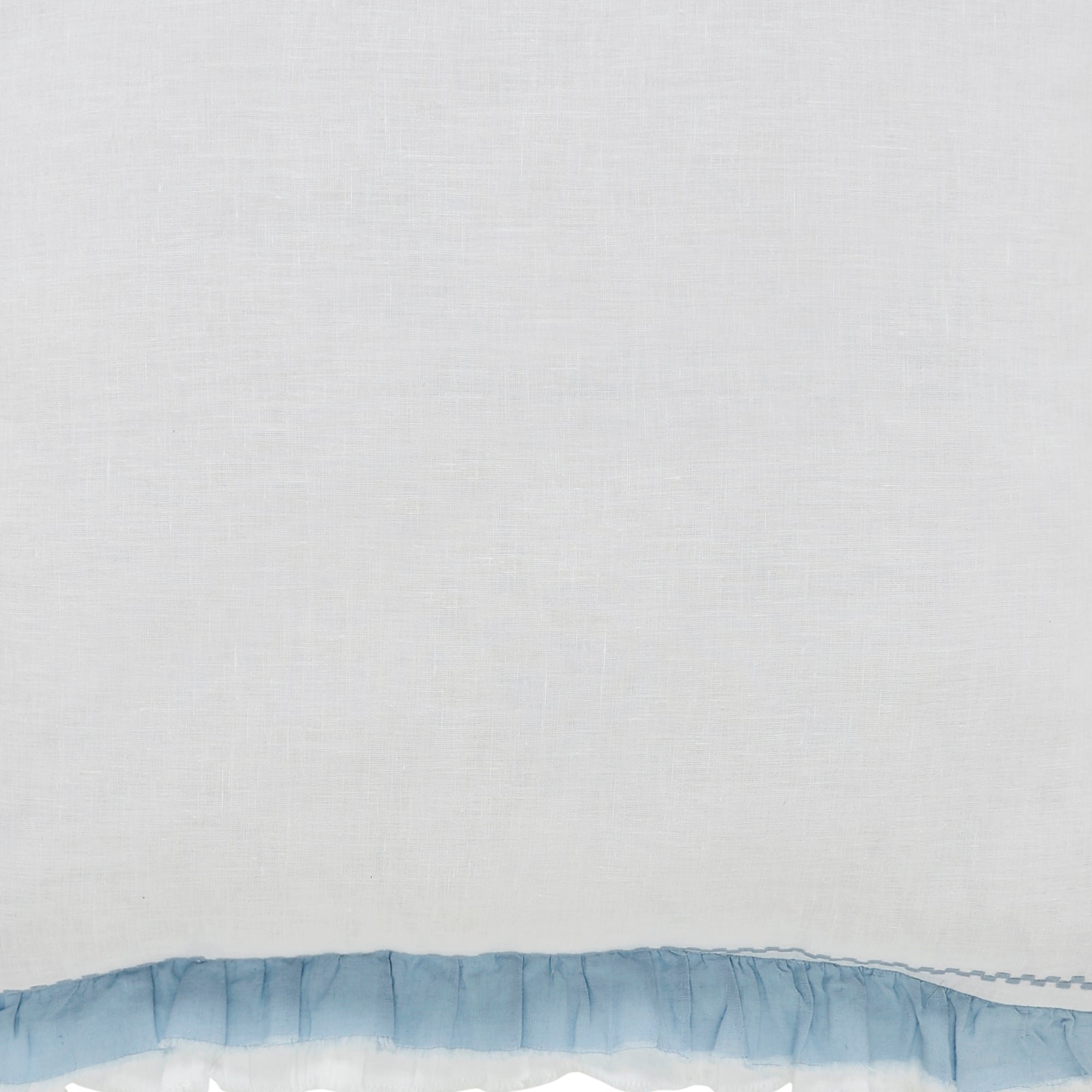 SWT-028-7.8_1|Pure white fabric complemented by a charming light blue ruffled border detail. Soft and elegant for bedding or curtains.