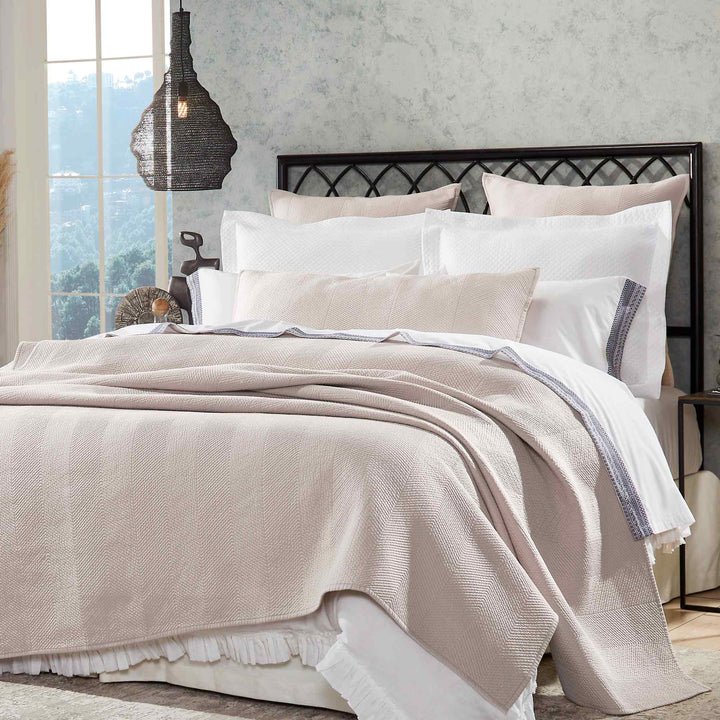 CL-171-11096_2|Neutral beige chevron coverlet enhancing a queen bed. Luxurious and textured bedding, ideal for a modern bedroom update.