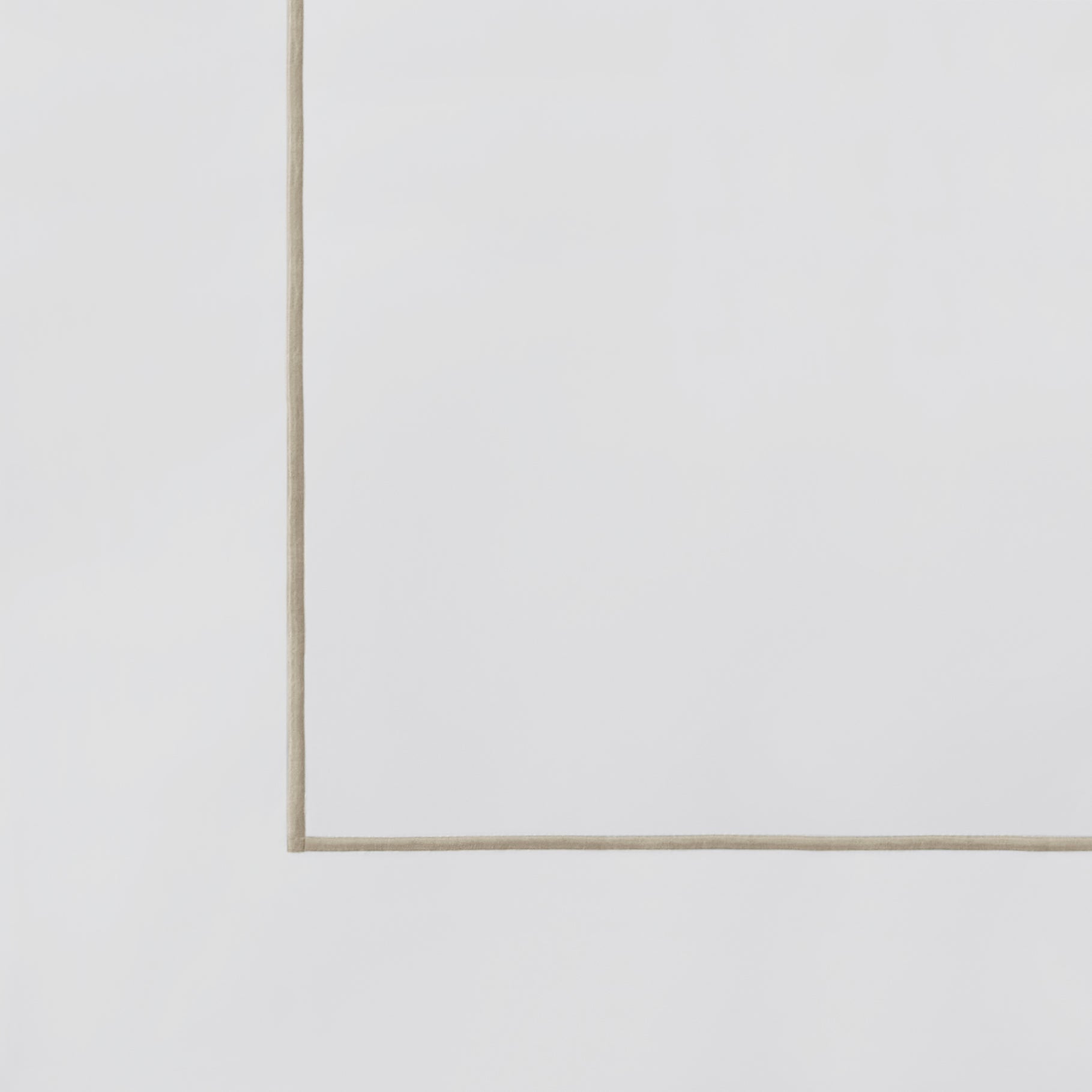 ASP-531-2032_6|Close-up of a pure white 100% cotton sheet corner, highlighted by a clean, elegant beige stitched border. Experience superior bedding comfort.