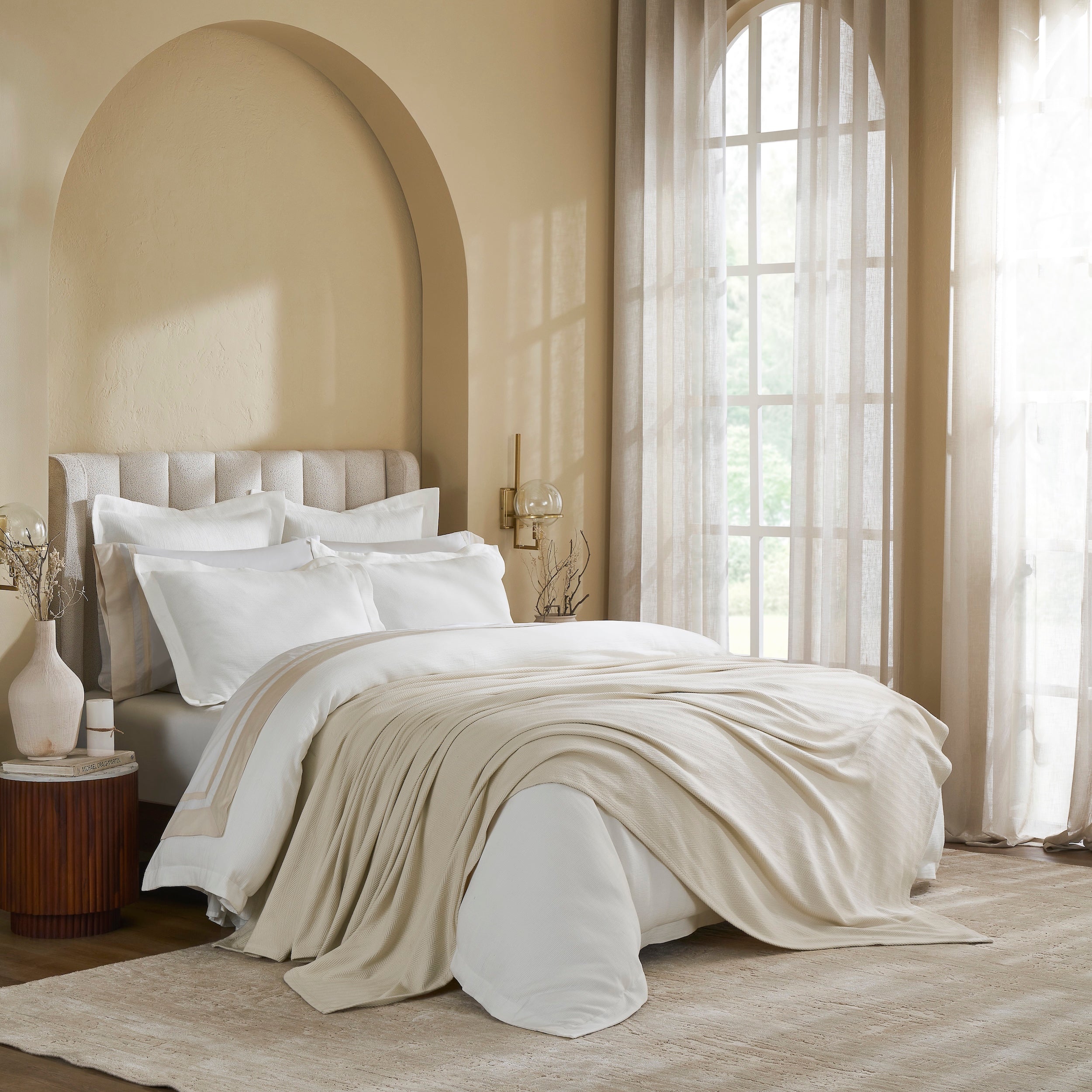 BL-866-11096_3|Elegant cream ribbed throw blanket draped on a bed, providing a soft, luxurious touch and cozy comfort to any bedroom.