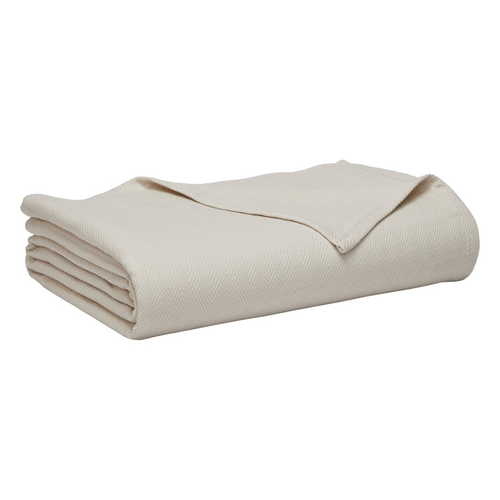 BL-866-9496_8|Folded light beige blanket with subtle herringbone weave, perfect for cozying up. Soft, warm bed linen for any home decor.