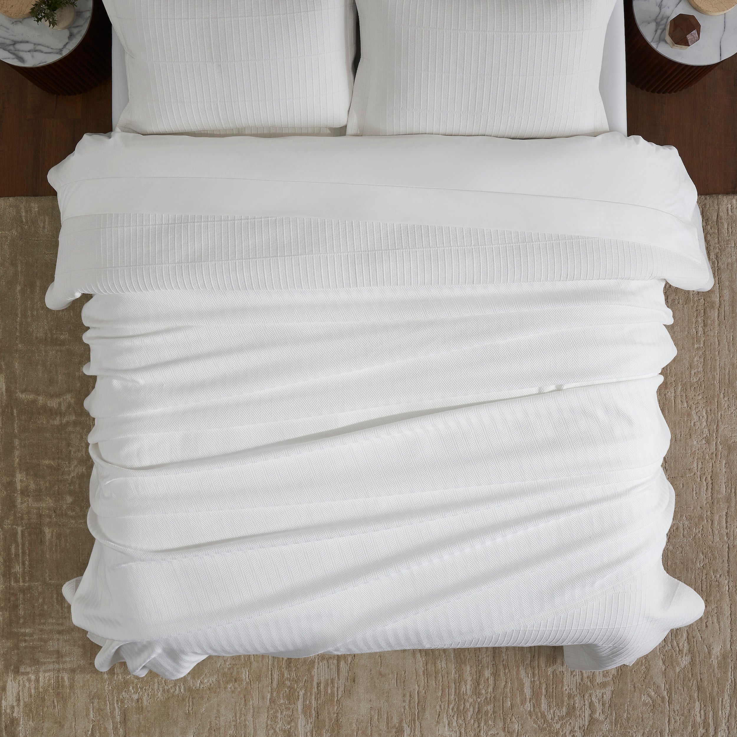 BL-865-9496_4|Overhead view of a modern bed featuring a crisp white ribbed blanket, offering warmth, comfort, and sophisticated bedroom decor.