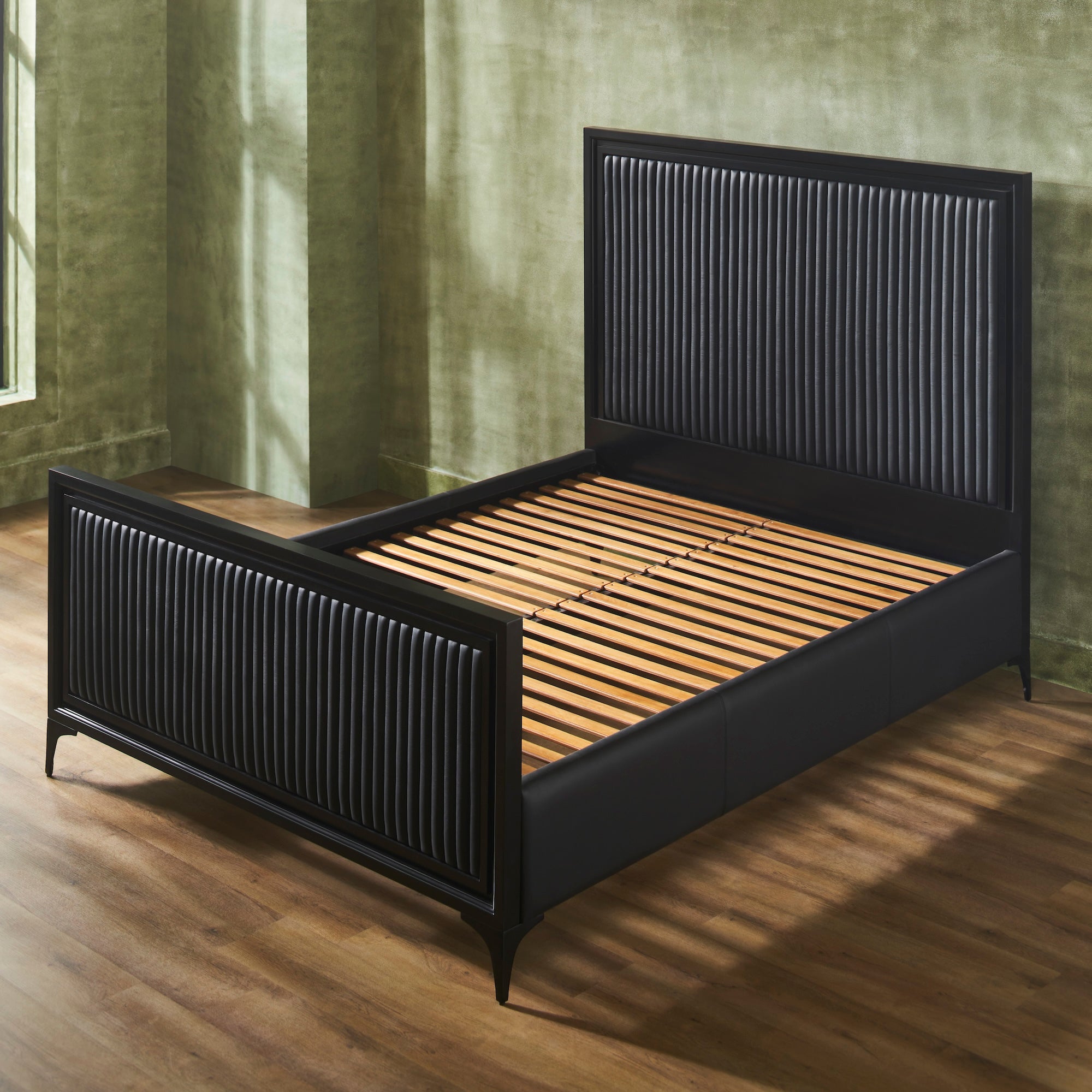 FN-5210-7680_4|Empty black channel tufted leather bed with black wooden frame, showcasing elegant bedroom furniture design with slats.
