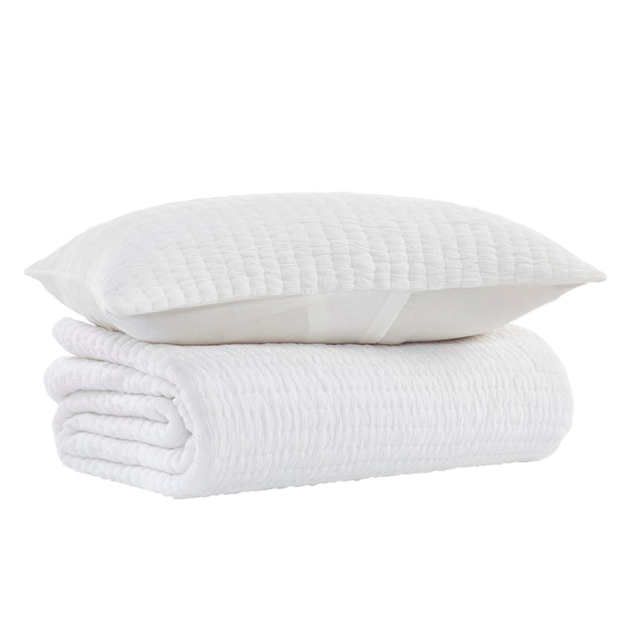 QT-358-9496_7|White quilted pillow and blanket set with subtle textured stripes, ready to add a clean, cozy, and inviting feel to your bed.