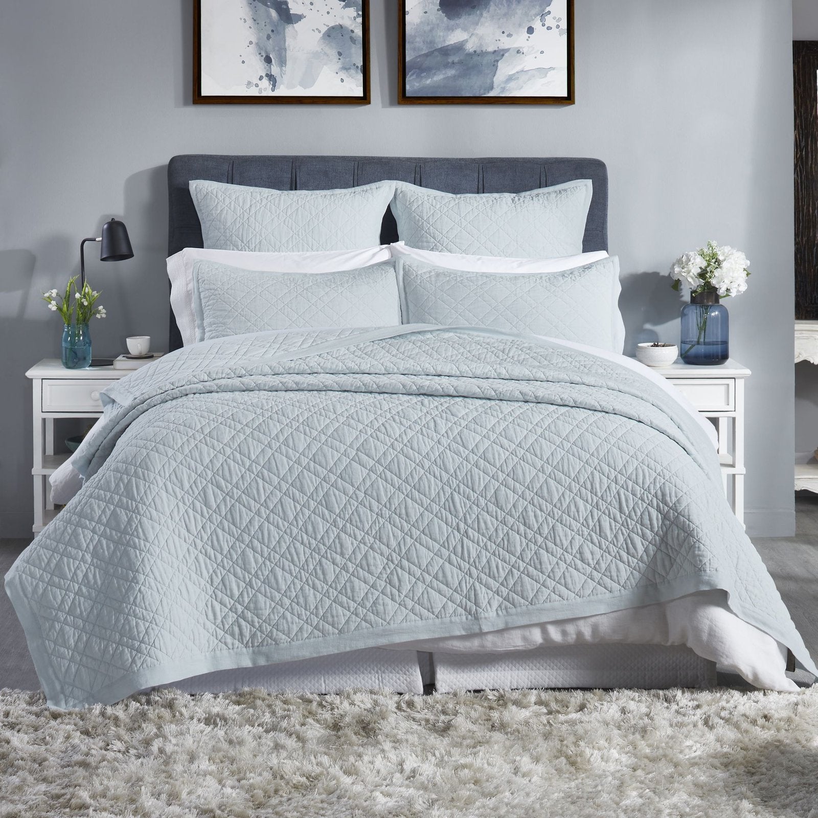 CL-255-9496_1|Serene light blue quilted coverlet dressing a modern bedroom, featuring a subtle diamond pattern for stylish comfort.