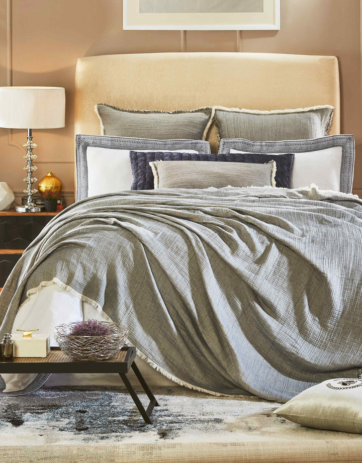 BT-104-9496_4|Luxurious gray fringed blanket on a styled bed, adding cozy warmth and modern elegance to any bedroom decor.