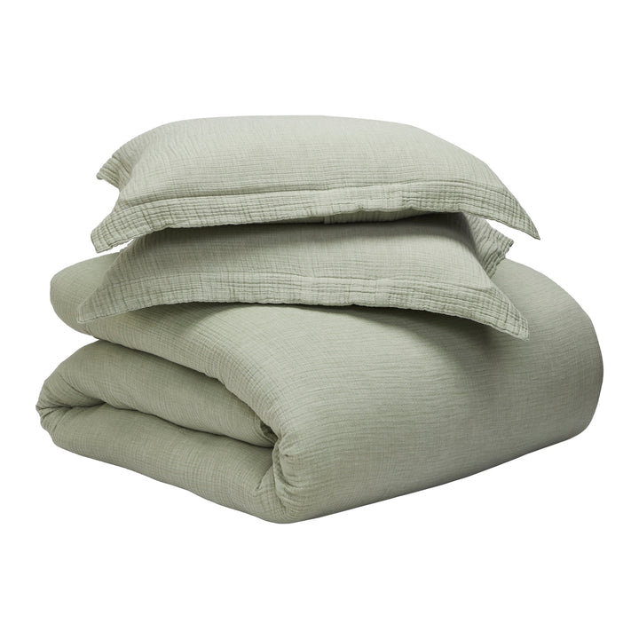 DT-051-9092_9|Folded stack of soft sage green textured cotton duvet cover and matching shams, ready for stylish bedroom decor.