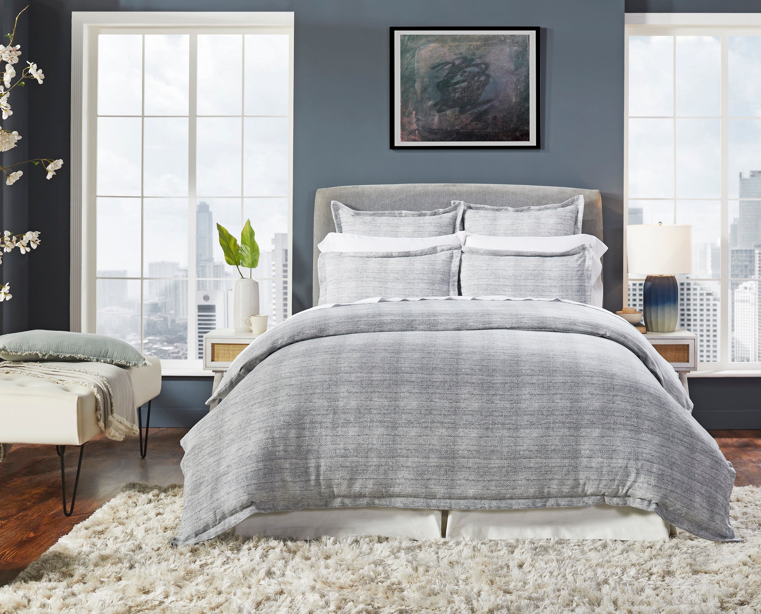 DT-035-10692_1|Sophisticated gray textured duvet cover set on a modern bed, enhancing a chic urban bedroom with large windows.