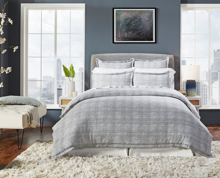 DT-035-10692_1|Sophisticated gray textured duvet cover set on a modern bed, enhancing a chic urban bedroom with large windows.