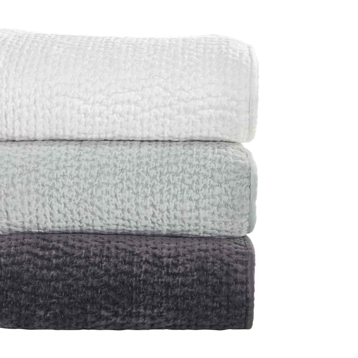 CL-182-9496_6|Stacked white, light gray, dark gray textured coverlets, soft quilted bedding for modern bedrooms. (117 chars)