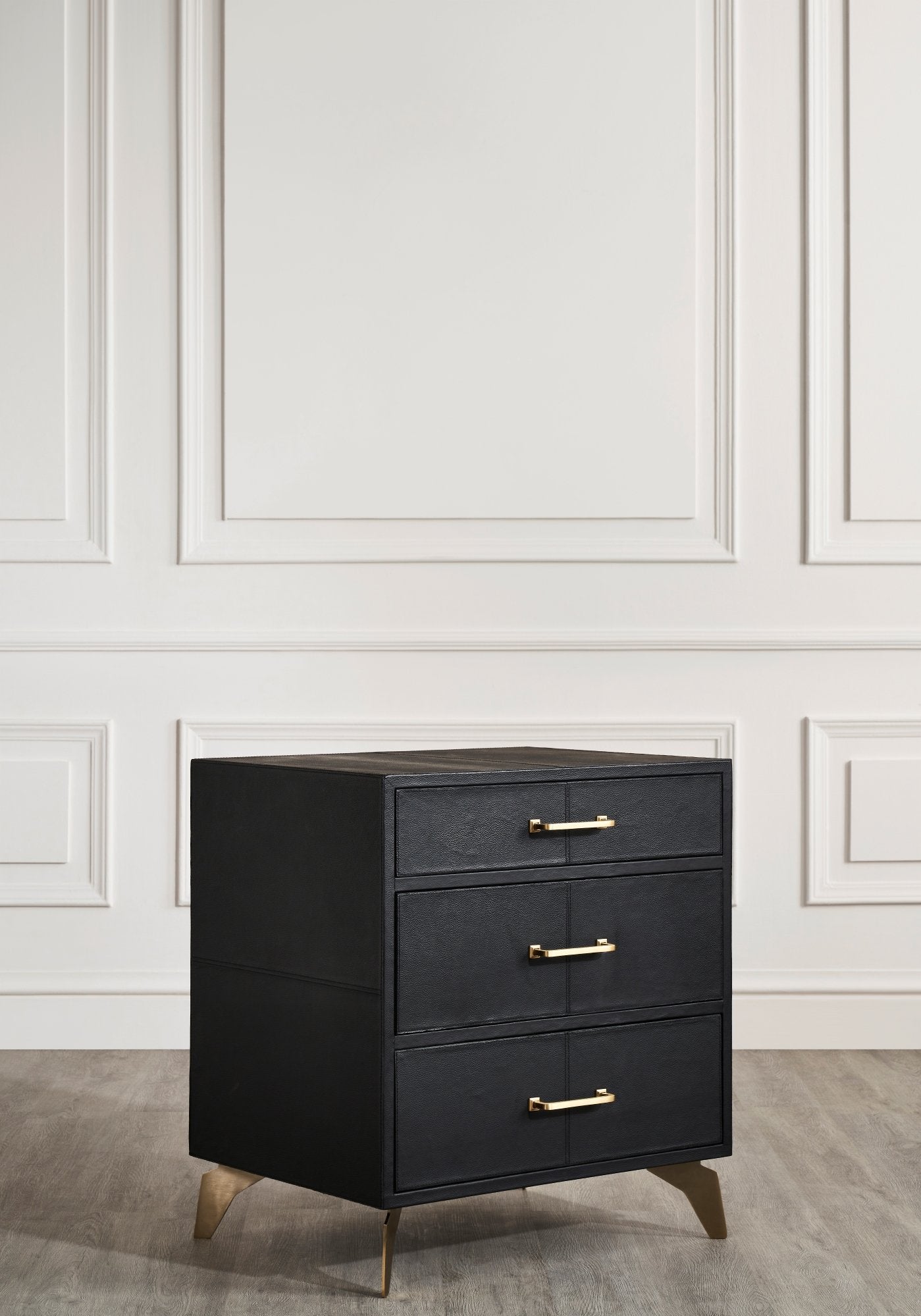 FN-5200-262028_3|Chic black three-drawer nightstand with elegant gold bar pulls & tapered legs, enhancing a contemporary space.