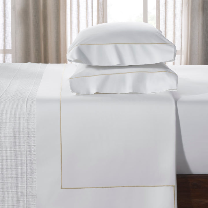 KFL-531-7880_3|Luxurious white 100% cotton sheets with elegant gold trim. Provides ultimate comfort and a premium bedding experience.