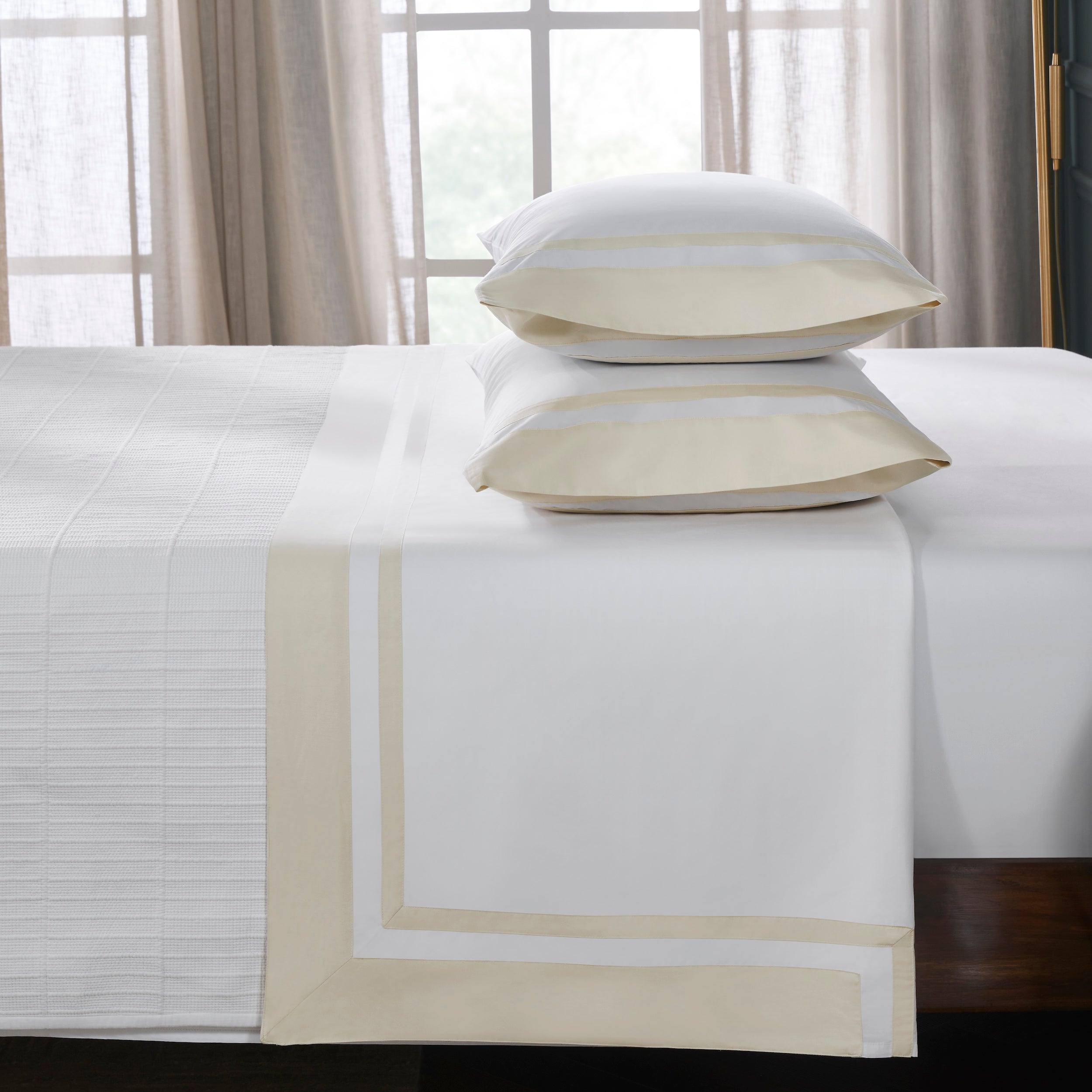 TFL-540-3980_3|Premium 100% cotton white sheets and pillowcases, folded neatly with elegant light beige stripe borders for beds.