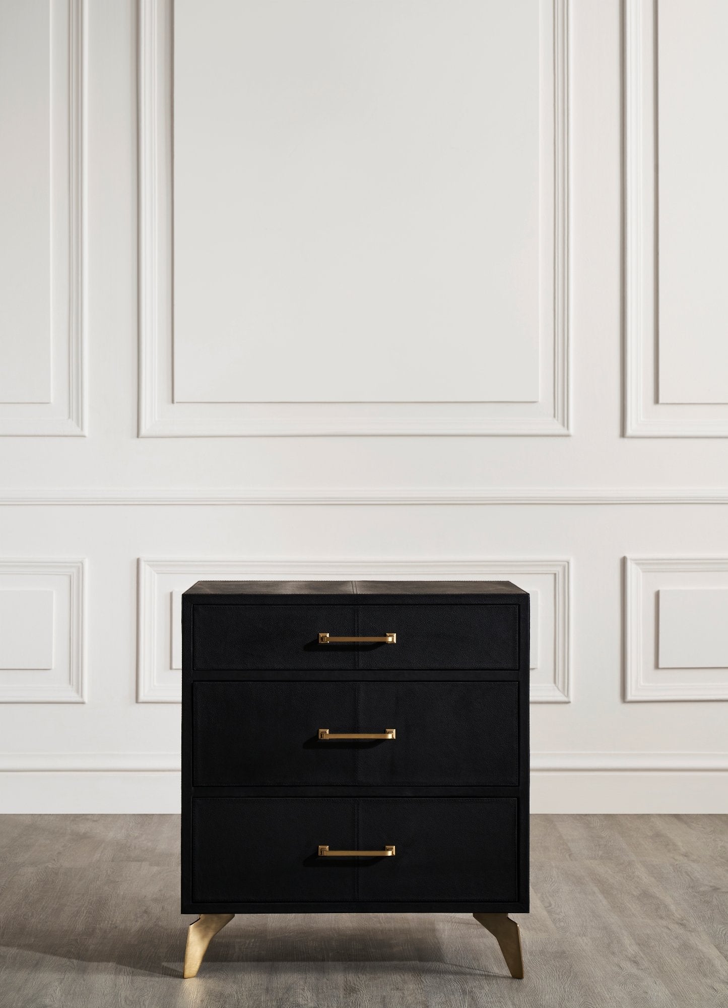 FN-5200-262028_2|Elegant black three-drawer nightstand featuring modern gold bar pull handles on a white paneled wall background.