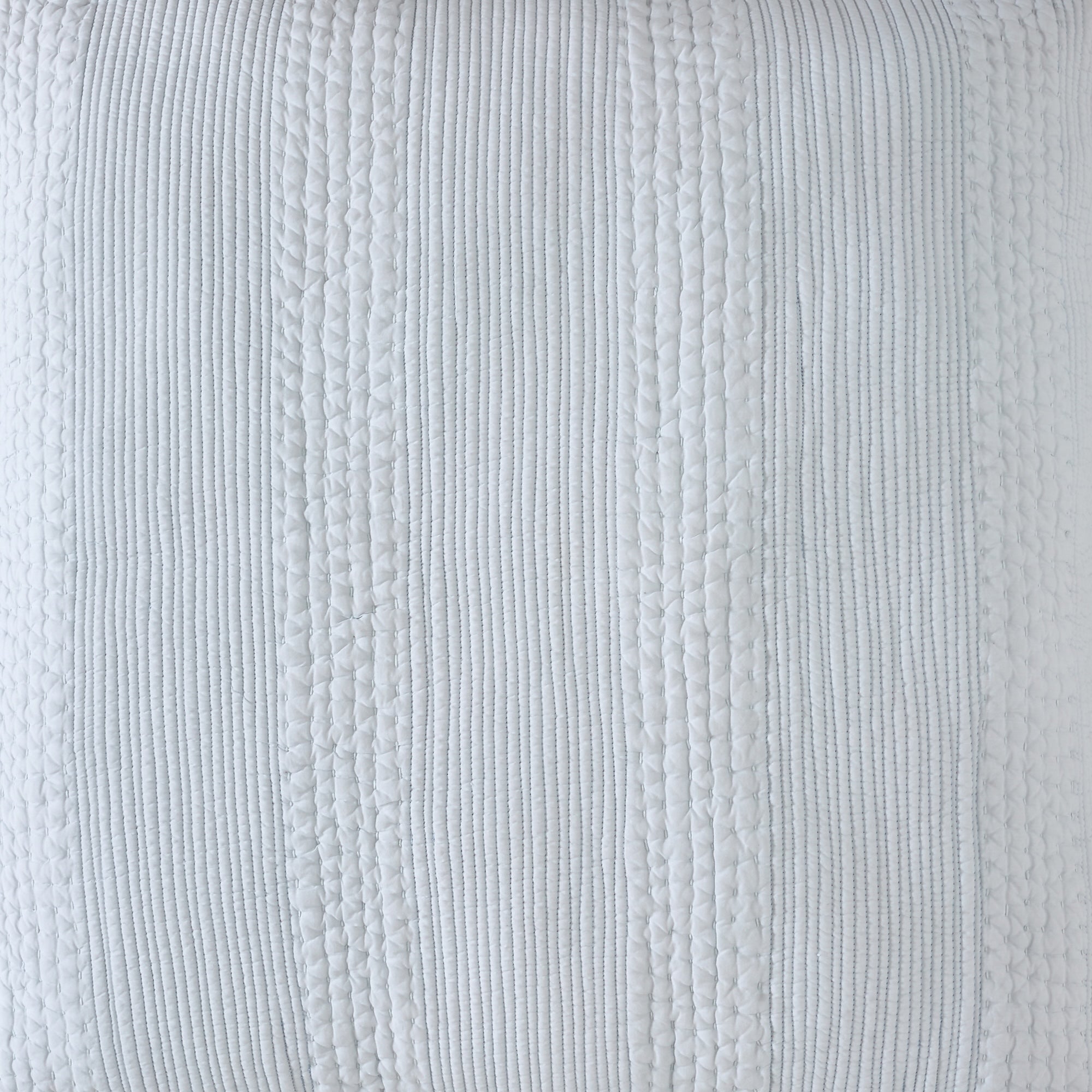 CL-257-11096_5|Close-up of a light blue textured coverlet fabric, highlighting its delicate stripe and subtle geometric quilt patterns.