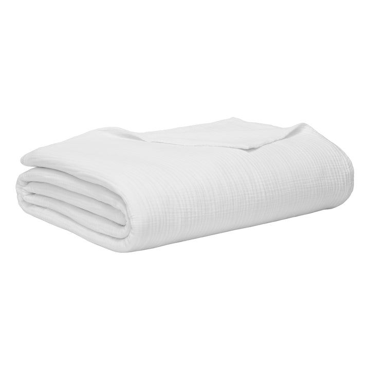 BL-861-9496_8|Elegantly folded white crinkled cotton blanket with a soft texture, offering versatile comfort as a cozy throw or bedding layer.
