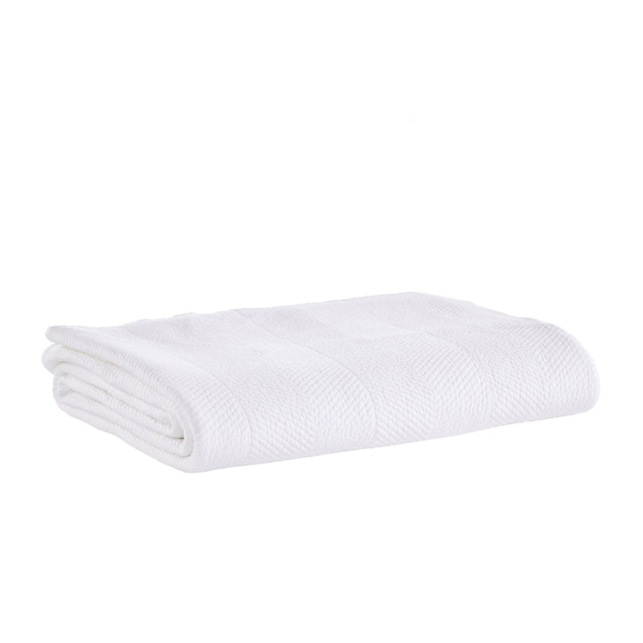 CL-170-9496_5|Pristine white chevron textured coverlet neatly folded, providing a clean, elegant, and modern bedding solution.