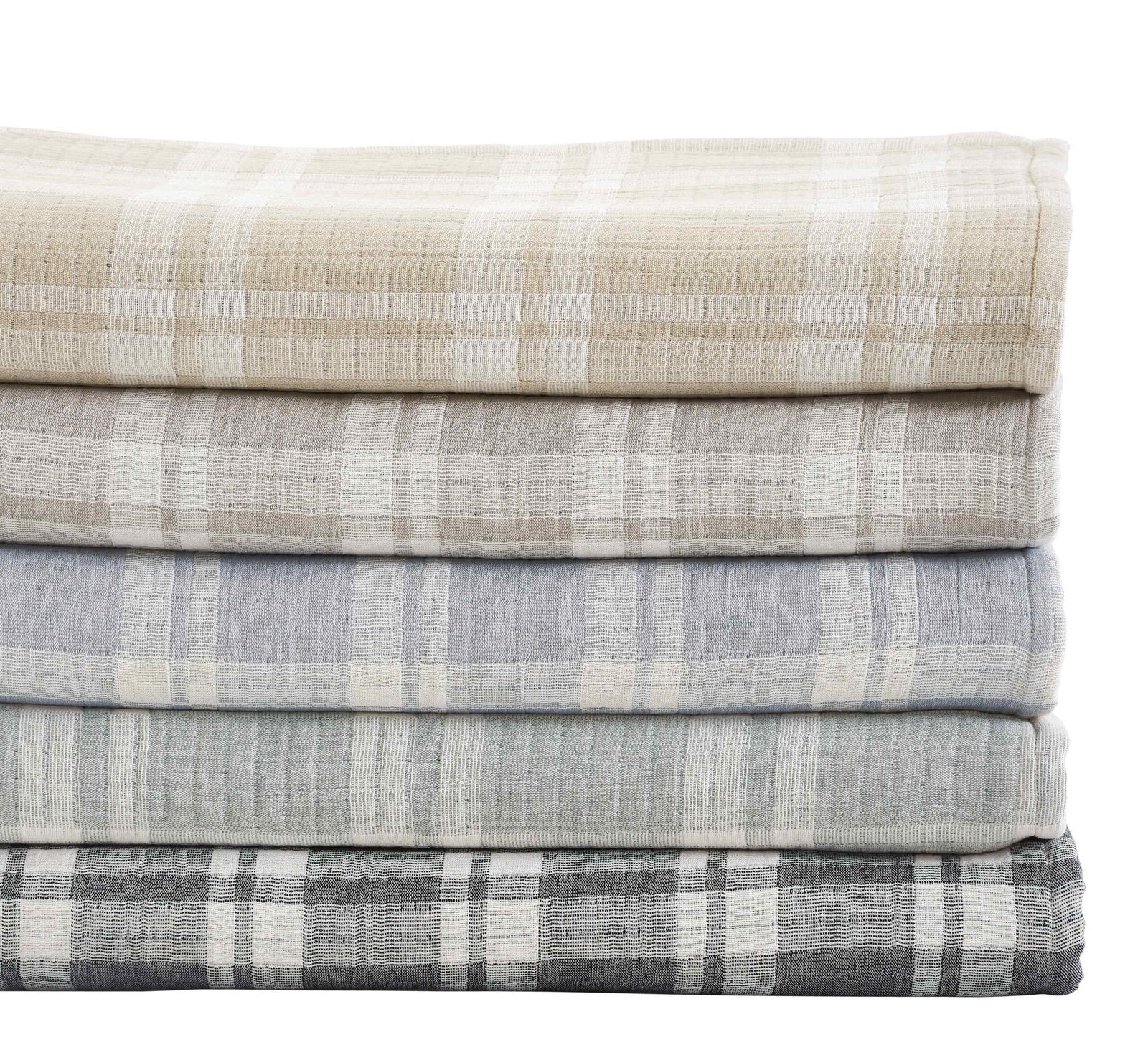BT-119-9496_2|Stack of five soft, reversible plaid blankets in varying neutral shades: beige, light grey, blue, grey, and charcoal.