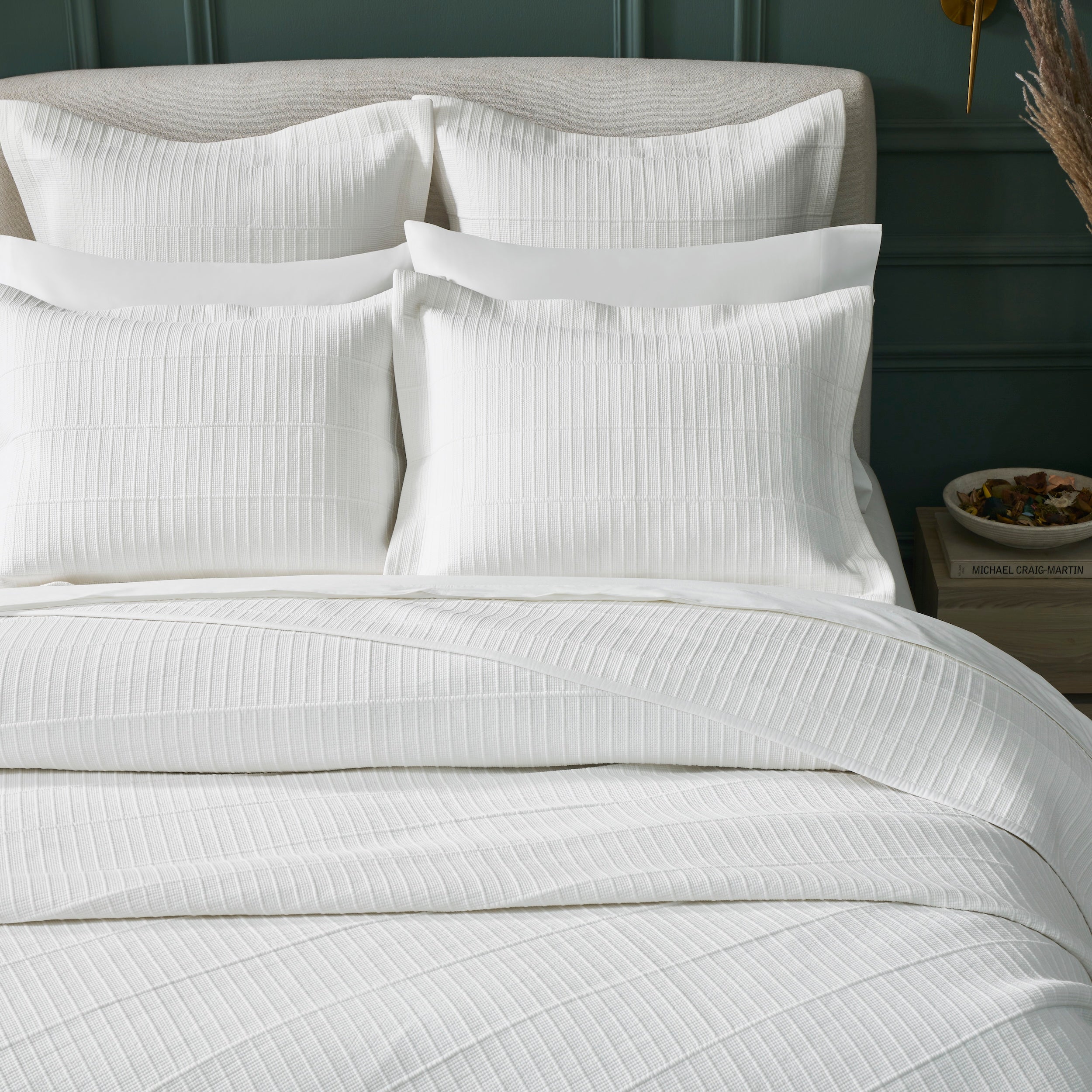 CL-268-9496_4|Elegant white textured coverlet with a refined striped pattern, closely detailed on a comfortable modern bed setup.