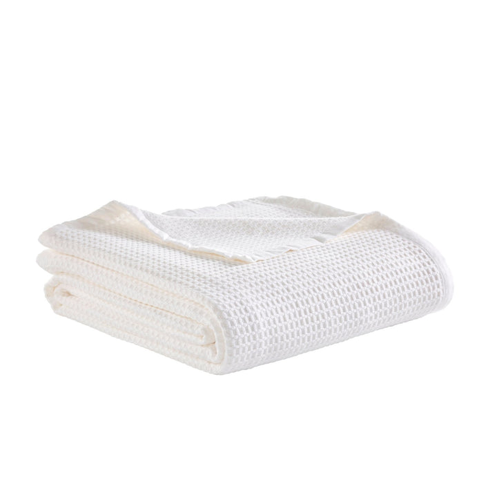 BL-856-11096_3|Perfectly folded white waffle weave blanket, ideal for adding a touch of classic comfort and texture to any room.