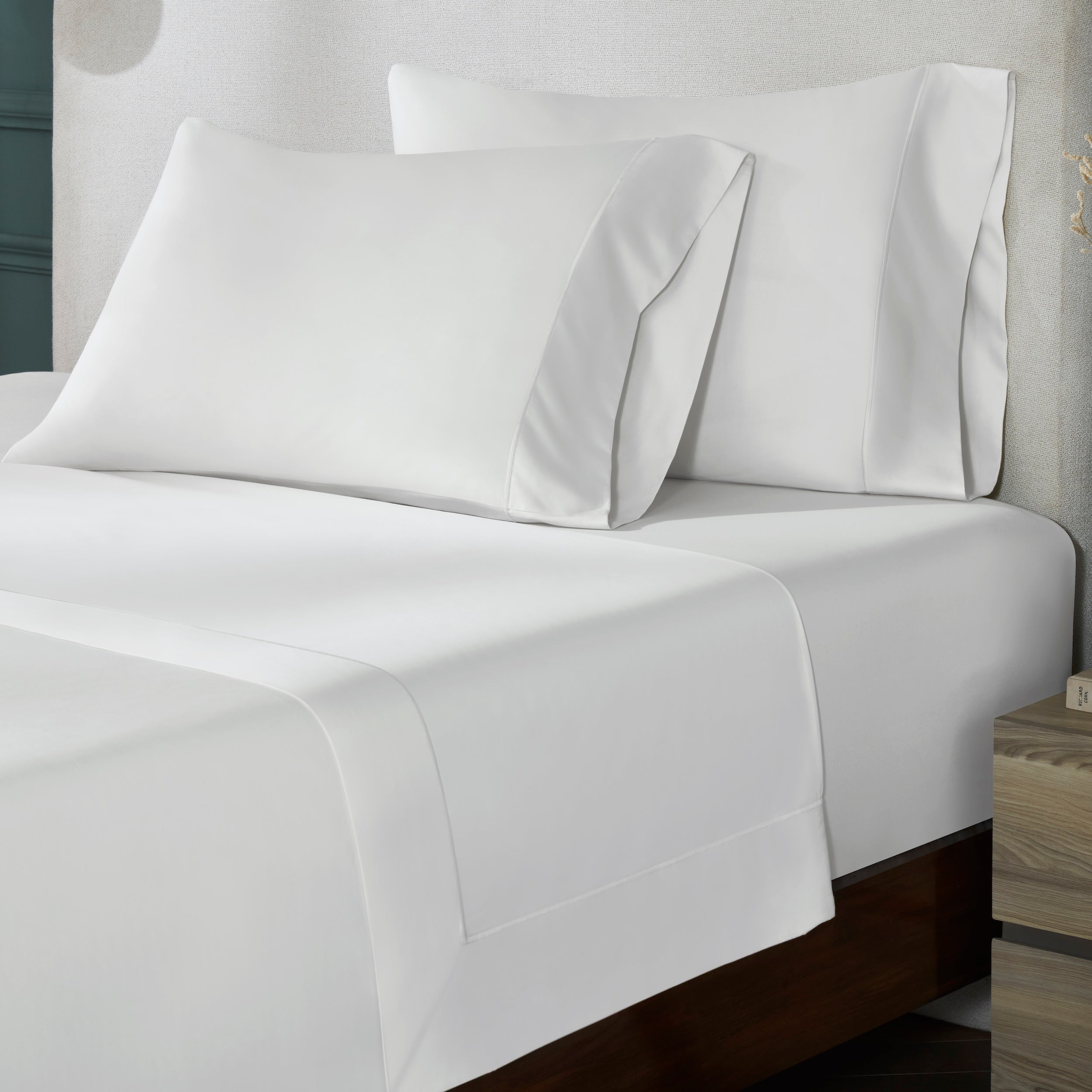 TFT-546-3975_3|Crisp white 100% cotton sheet set, featuring a flat sheet and two pillowcases with a smooth weave and subtle border detailing.