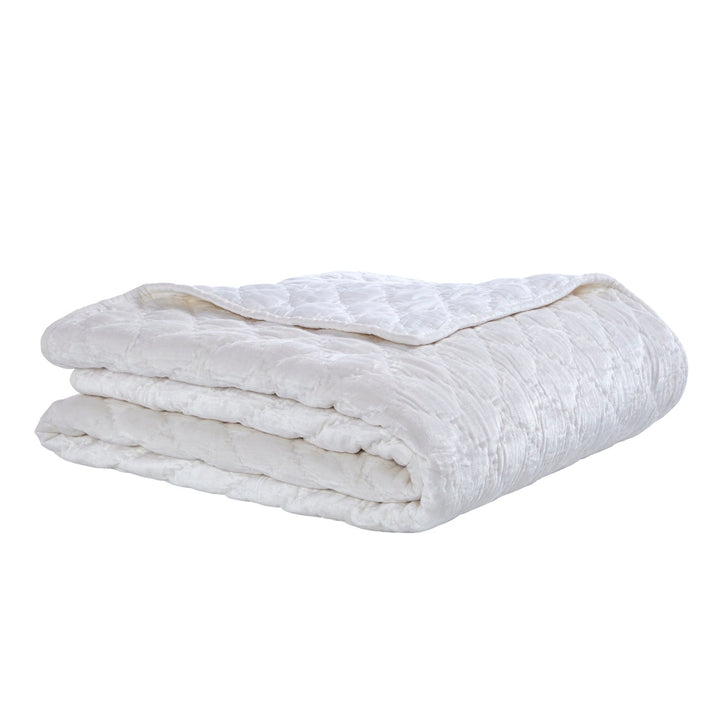 QT-343-9496_2|Folded white velvet quilt showcasing intricate diamond quilting. Luxuriously soft and plush, perfect for crisp bedroom comfort.