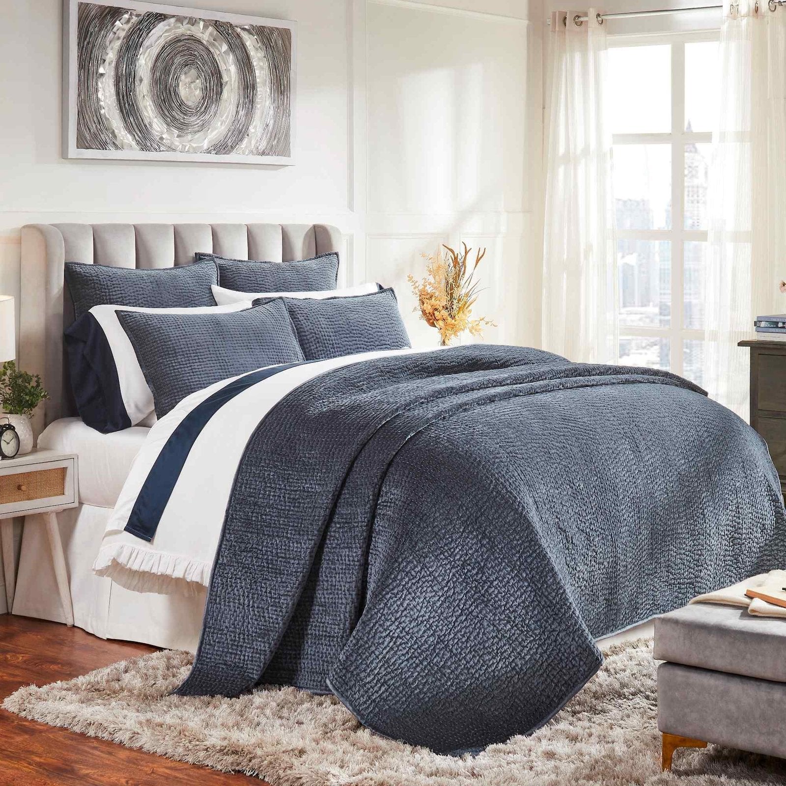 CL-195-9496_2|Luxurious navy blue quilted coverlet draping a bed with matching pillows, adding elegance and comfort to the master bedroom.