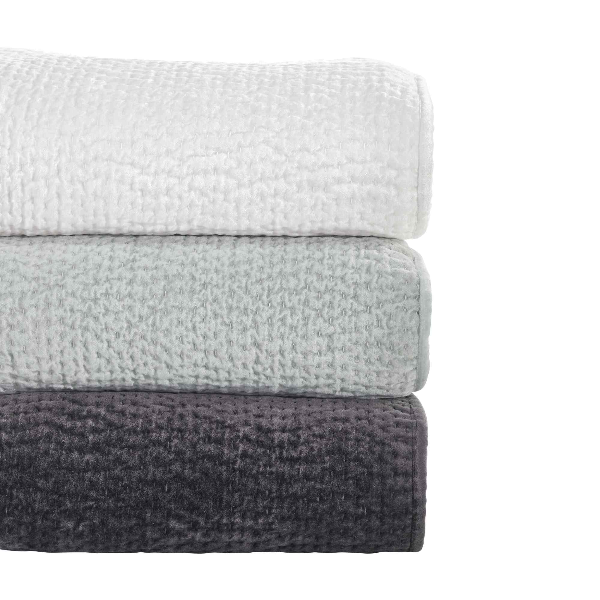 CL-182-11096_6|Stack of three elegant quilted coverlets in white, light gray, and dark gray, soft premium bedding options.