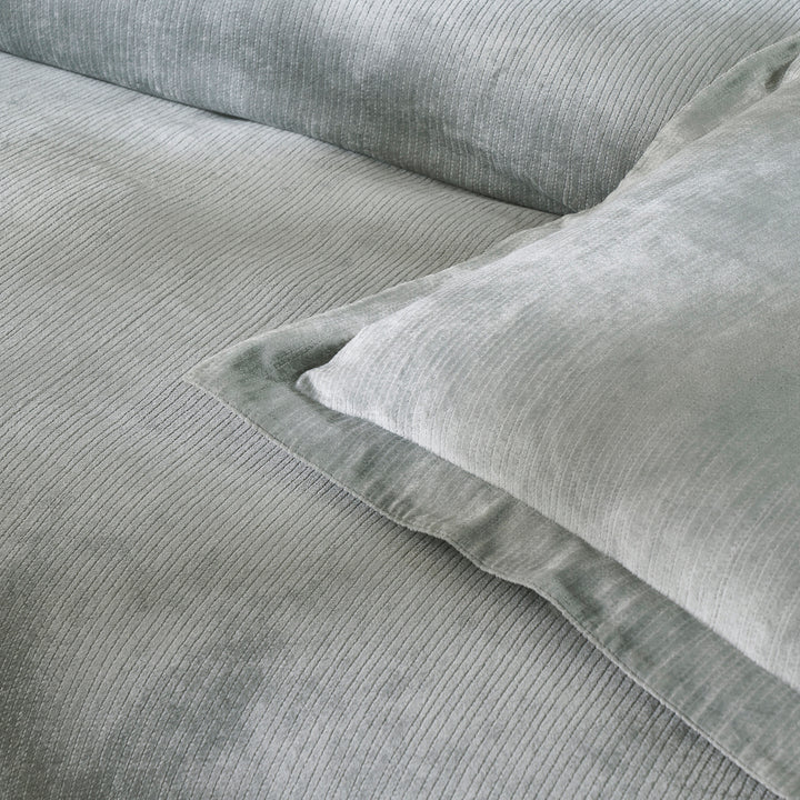 SS-054-2026_3|Close-up of luxurious soft grey velvet corduroy duvet cover and coordinating pillow sham, adding texture to bedding.
