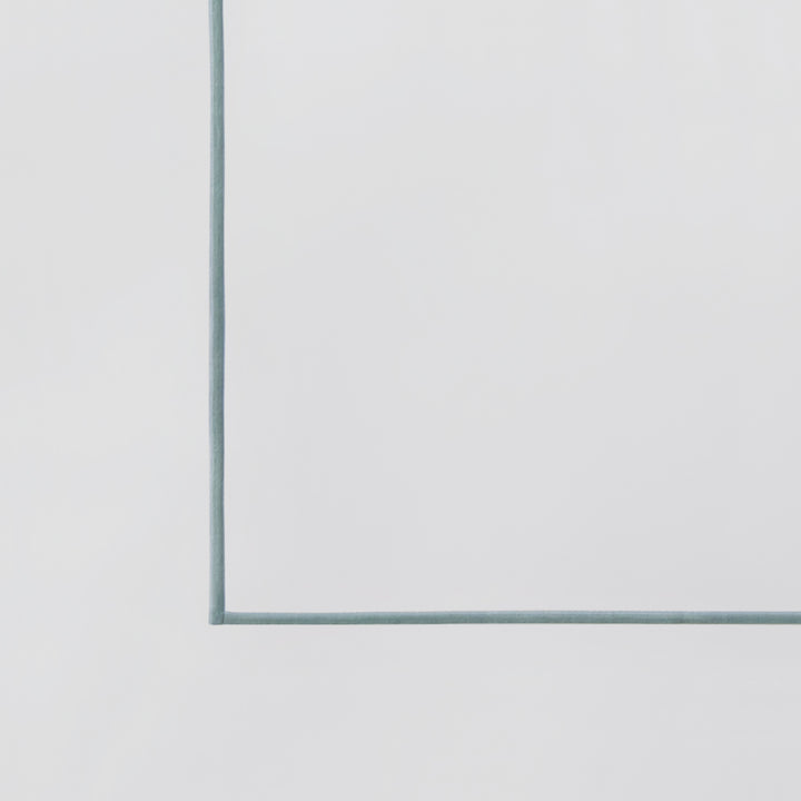 TFL-530-3980_7|Pristine white 100% cotton sheet swatch with subtle teal piping, highlighting the quality and elegant color detail.