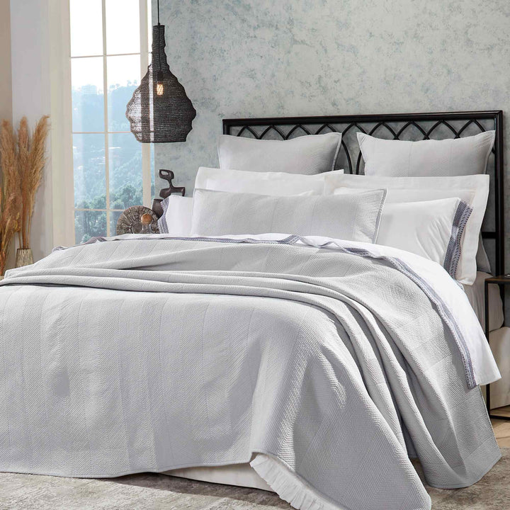 CL-172-11096_2|Contemporary light grey quilted coverlet with a herringbone pattern, creating an inviting and comfortable bedroom look.