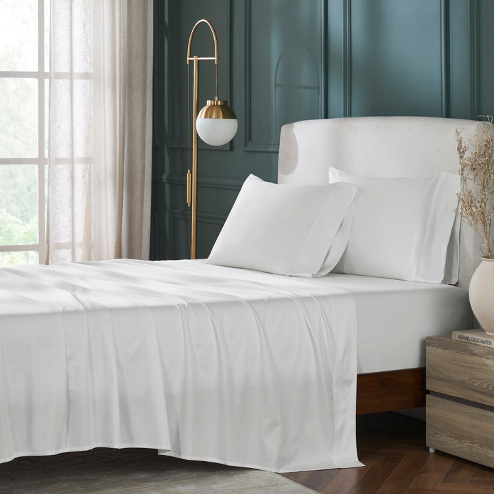 QSS-539-6080_1|Crisp white 100% cotton sheets on a neatly made bed, showcasing breathable and soft natural bedding for a luxurious feel.