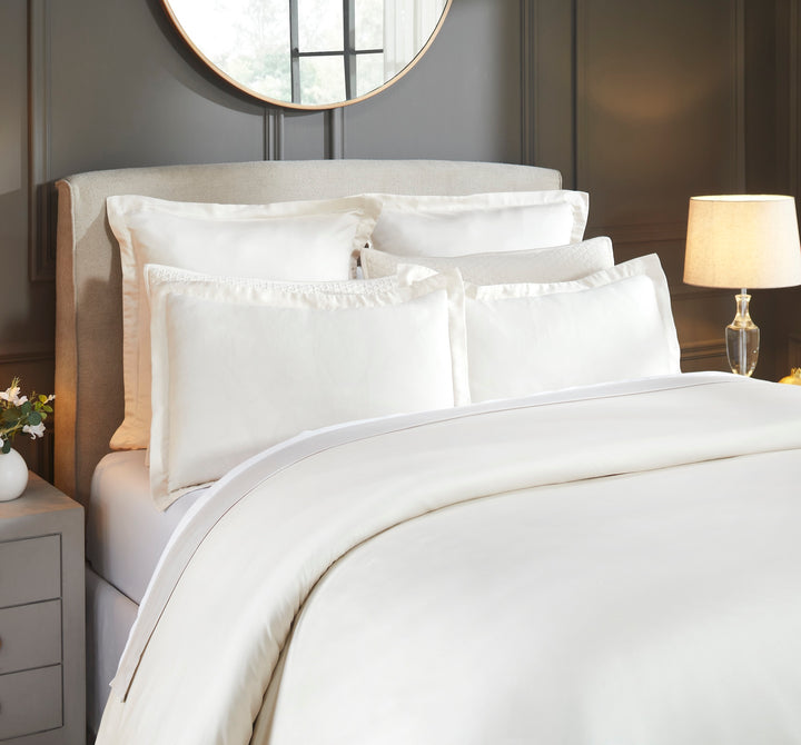 DT-046-10692_3|Close-up of an elegant cream luxurious soft cotton duvet cover, adding sophisticated comfort to a timeless bedroom.