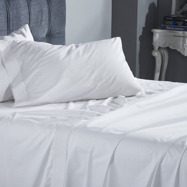 QSS-520-6080_4|White 100% cotton sheets with elegant decorative trim on a bed, providing luxurious, breathable percale bedding.