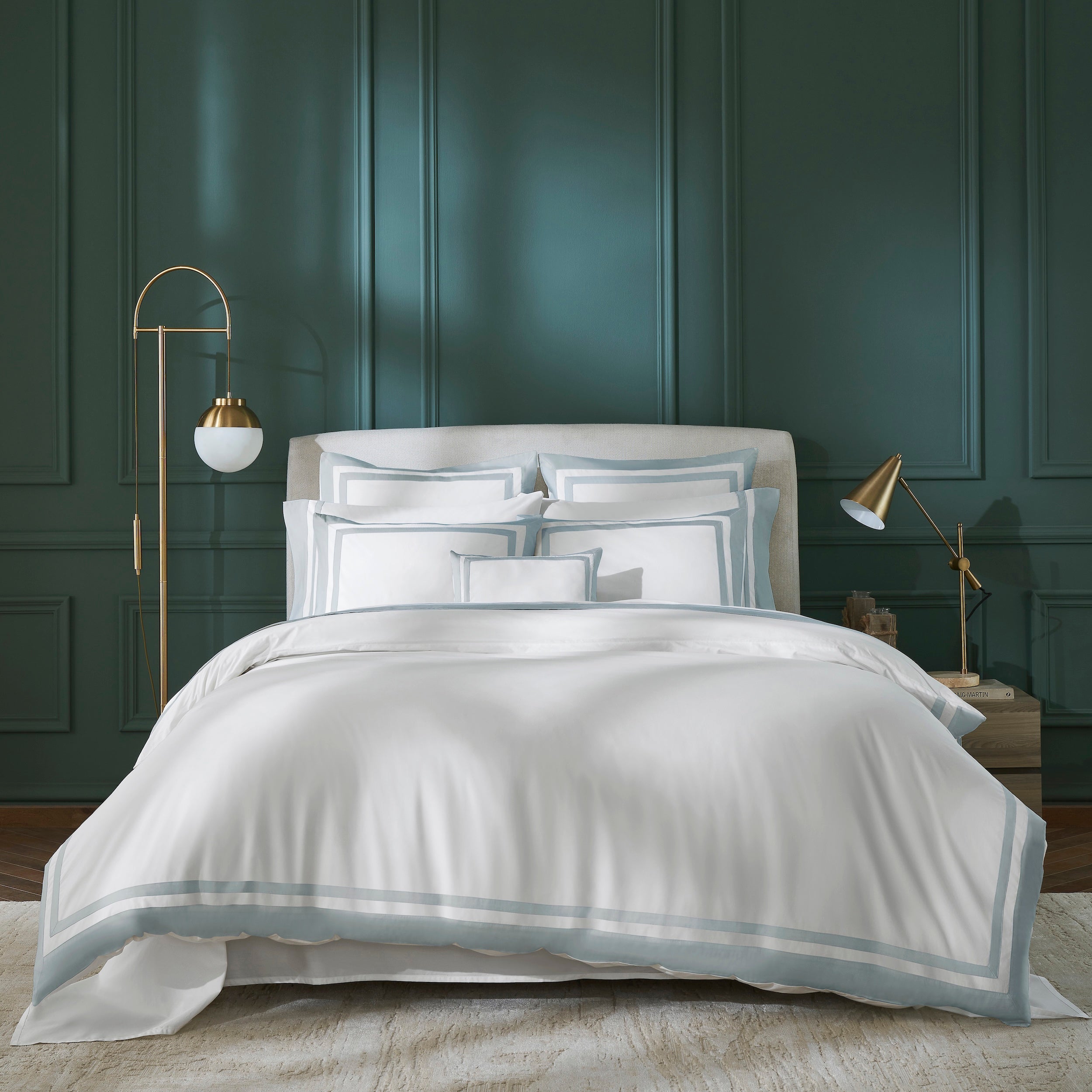 DT-063-9092_1|White luxury duvet cover set with serene light blue striped borders, creating an elegant focal point in a chic bedroom.