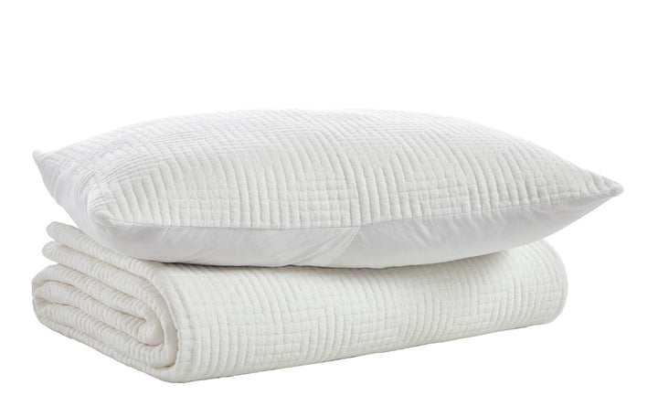 CL-199-9496_5|White quilted coverlet with a distinctive geometric maze pattern, folded neatly with a matching decorative pillow.