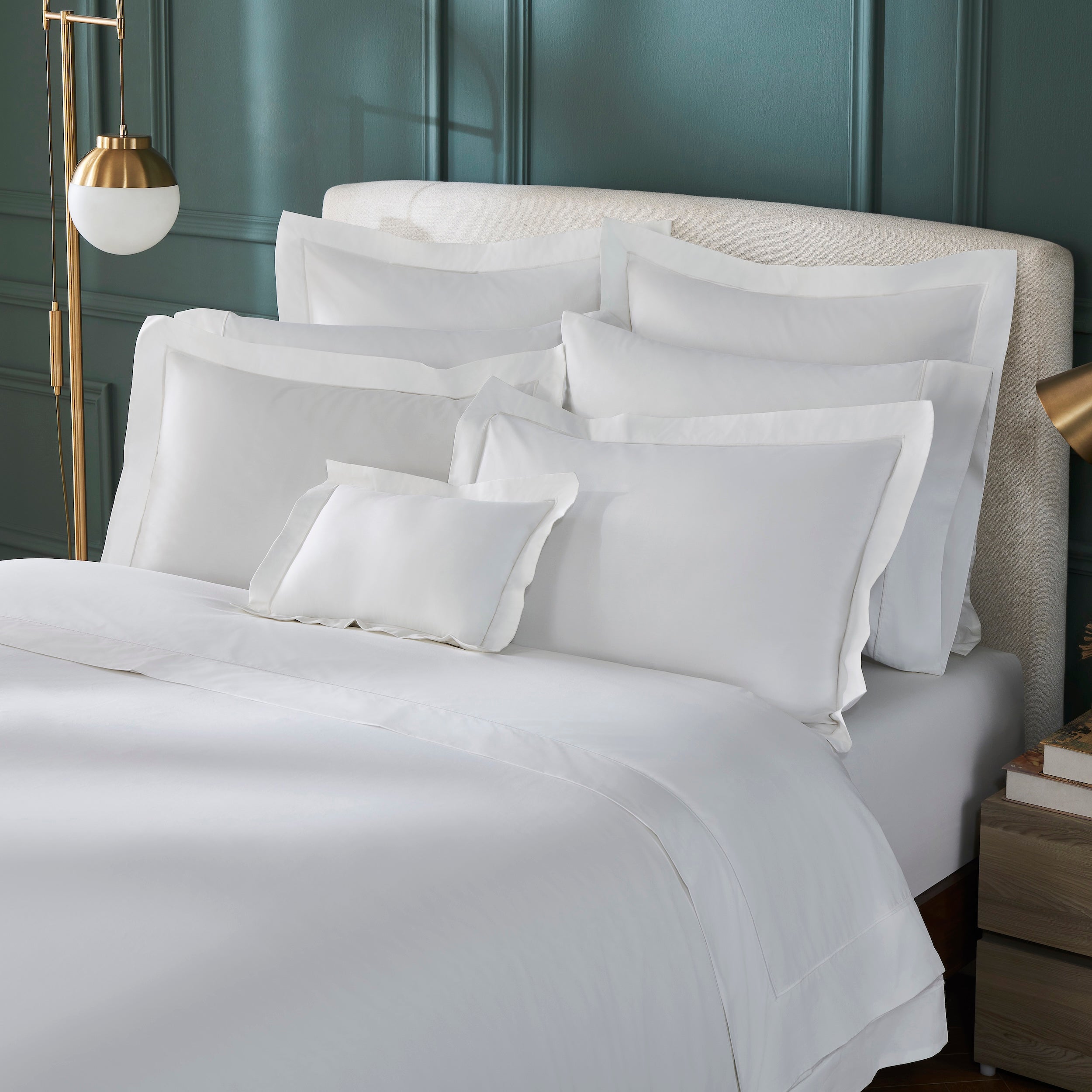 DT-058-10692_2|Close-up of luxurious white duvet cover and pillow shams, showcasing crisp fabric, subtle borders, and premium quality bedding.