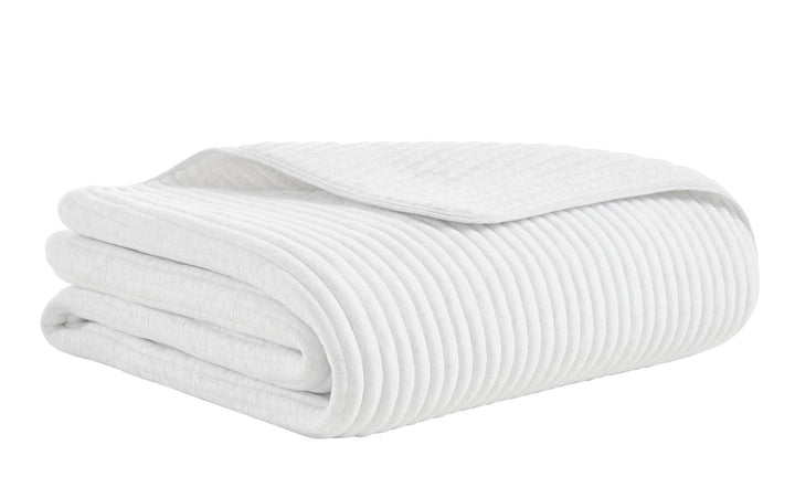 QT-367-9496_5|Folded white corduroy textured quilt, showcasing its soft ribbed pattern, ideal for cozy and stylish bedroom decor.