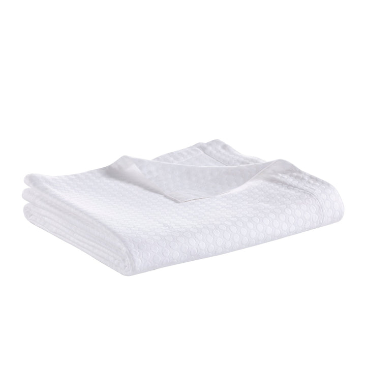 CL-174-11096_2|Folded white coverlet with a unique textured bubble pattern. Stylish and comfortable bedding for any home.