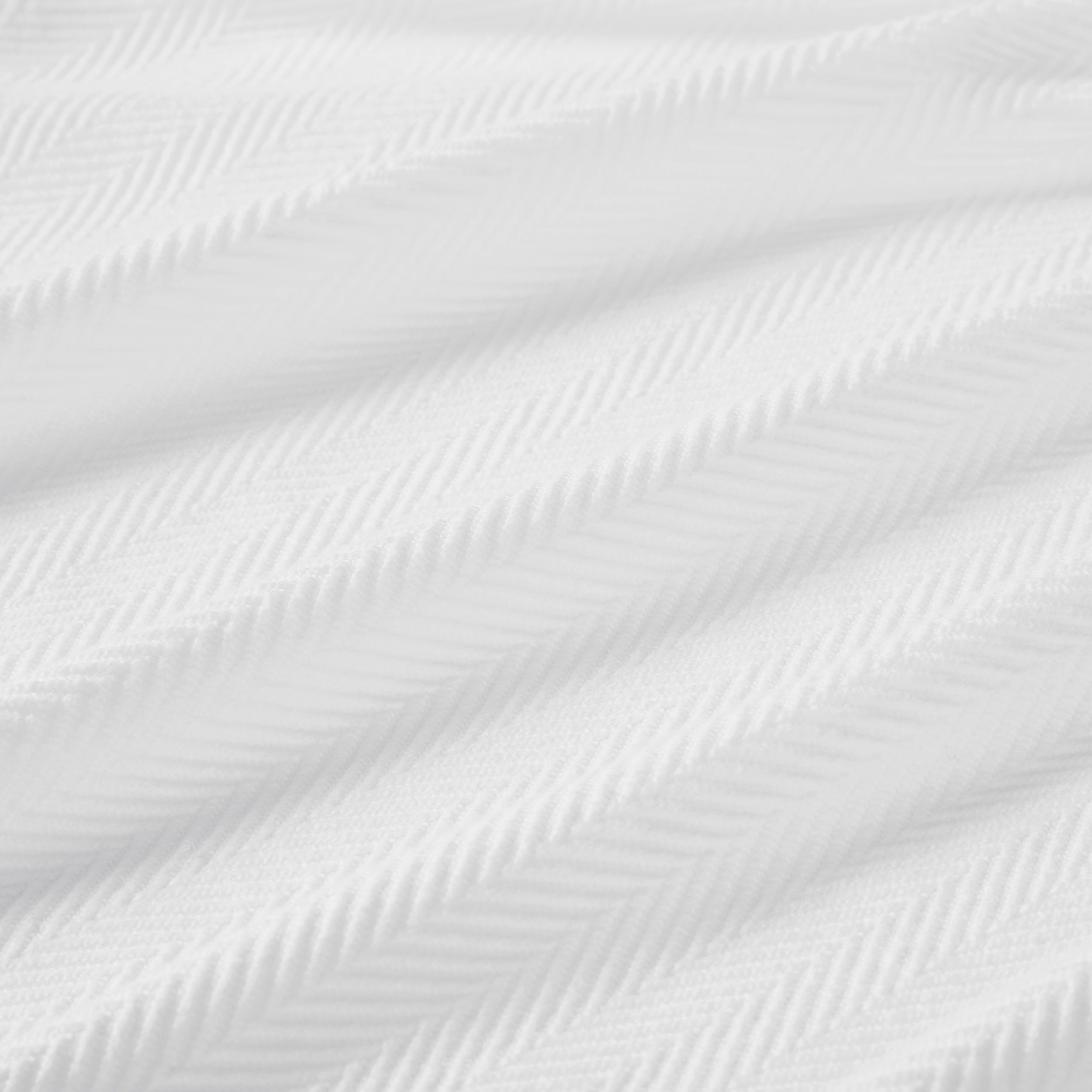 BL-865-9496_9|Detailed close-up of a premium white herringbone textured blanket fabric, showcasing its intricate and soft woven pattern.