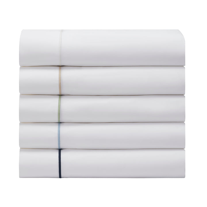 TFL-530-3980_6|Stack of five neatly folded white 100% cotton sheets with varied colored piping, showcasing diverse luxurious bedding.