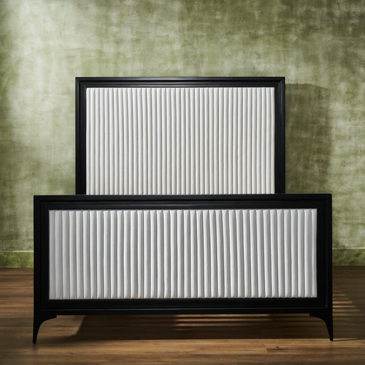 FN-5209-6080_5|Beautiful white leather bed with a black frame, prominently featuring the vertically channeled headboard and footboard design.
