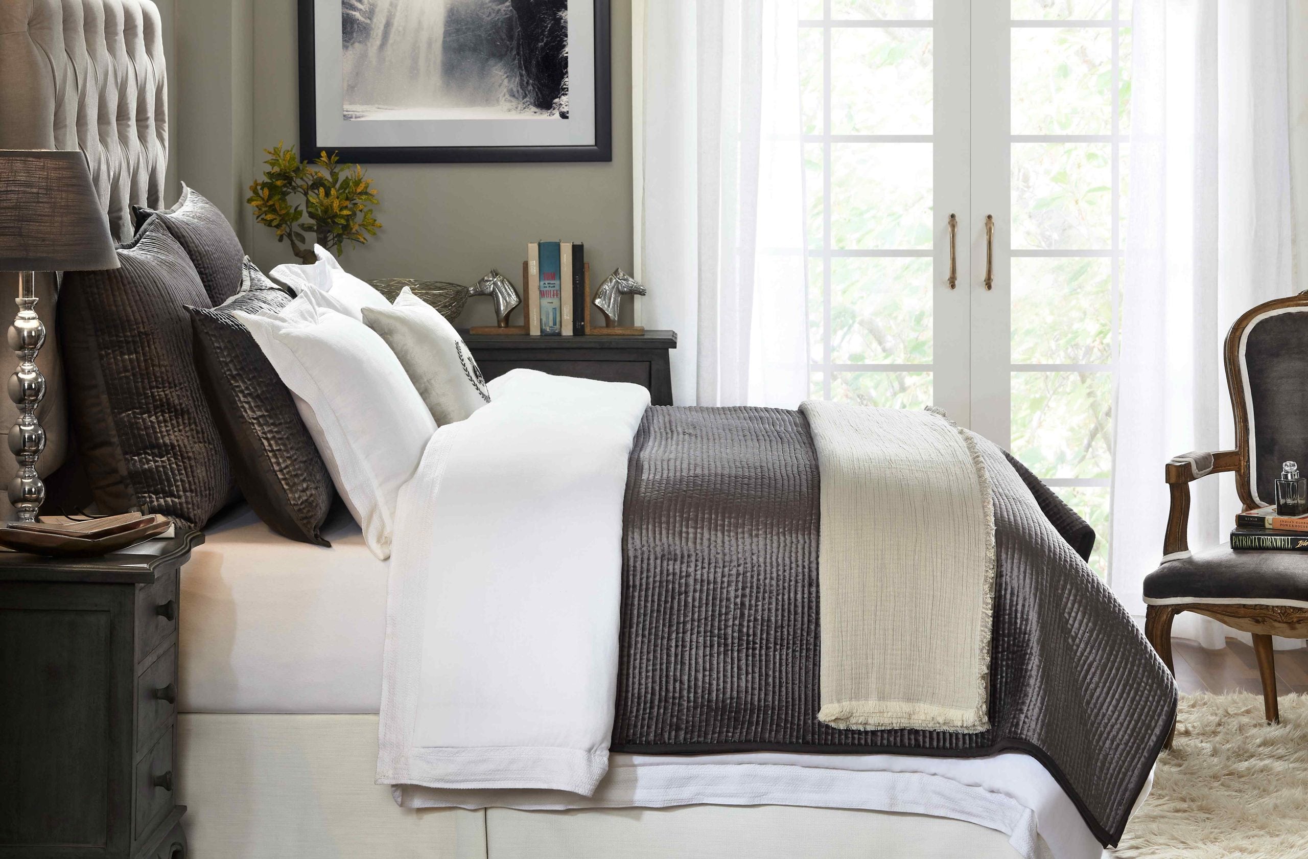 CL-153-11898_3|Elegant dark grey quilted coverlet casually layered on a bed, offering sophisticated style and comfortable sleep.