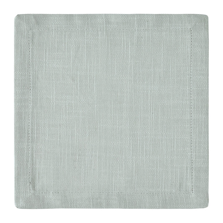 CNP-4906-66_3|Detailed close-up of a single light green linen fabric dinner napkin, highlighting its woven texture and clean hem on white.