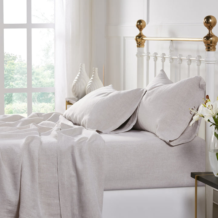 QSS-515-6080_2|Relaxed light beige 100% linen sheets on a bed, showcasing their natural drape and breathable comfort. Ideal for serene sleeping.
