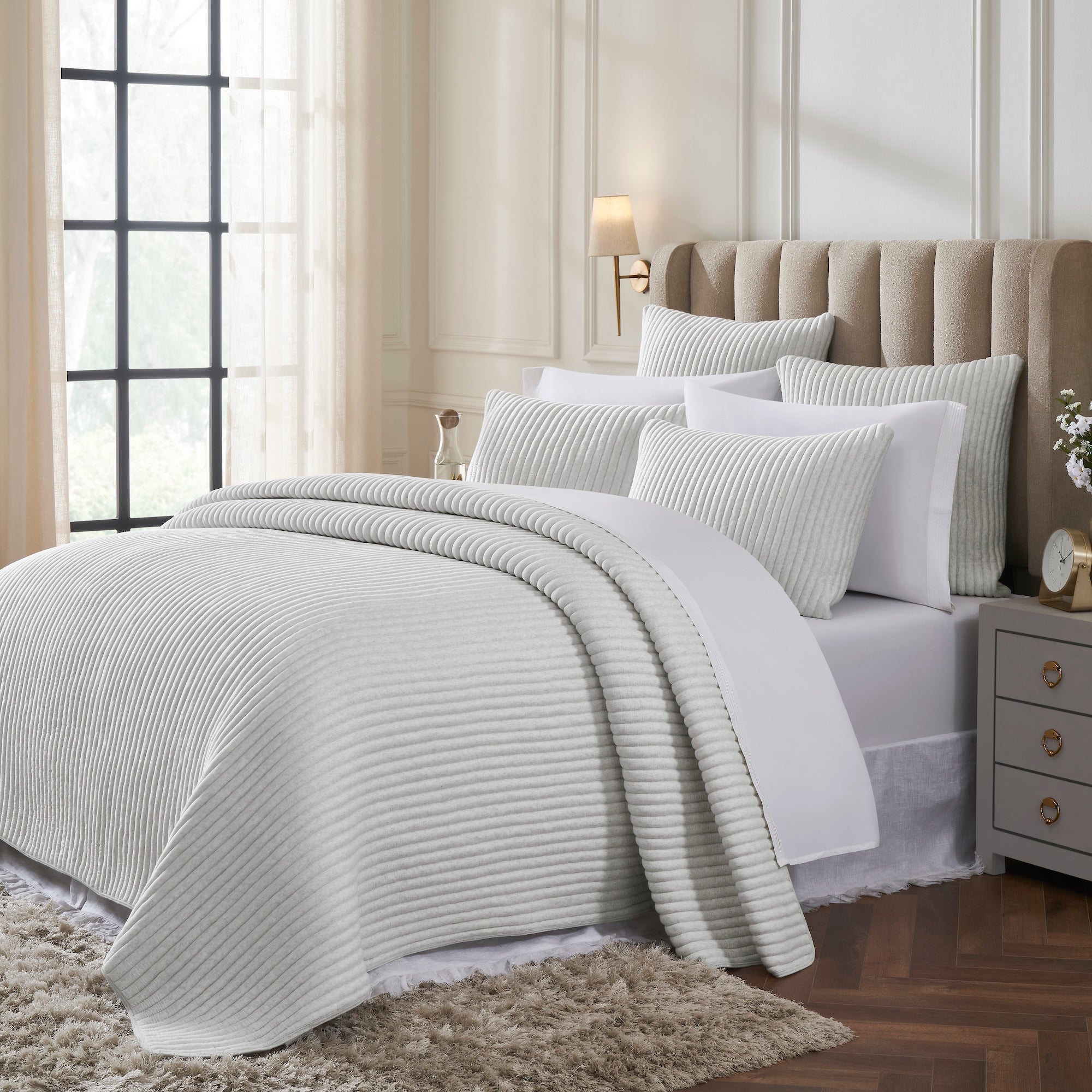 QT-374-9496_2|Cozy light grey ribbed quilt and pillows on a bed, creating a warm and inviting modern bedding ensemble for any room.